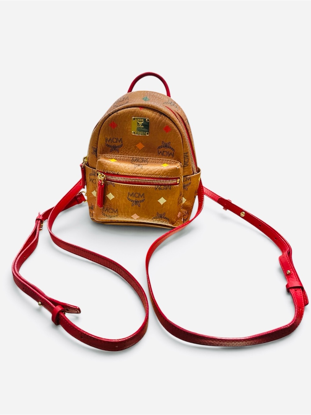 MCM Mini Stark Backpack in Cognac with Red Straps